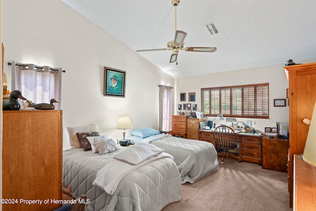 bedroom featuring ceiling fan, a textured ceiling, lofted ceiling, and carpet