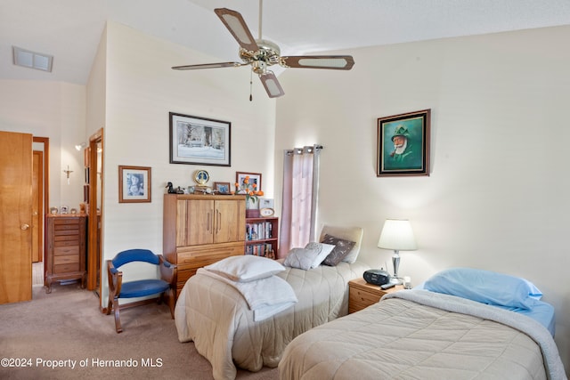 carpeted bedroom with ceiling fan and lofted ceiling