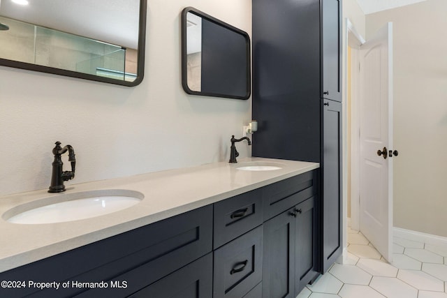 bathroom with vanity and tile patterned floors