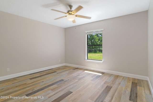 empty room with light wood-type flooring and ceiling fan