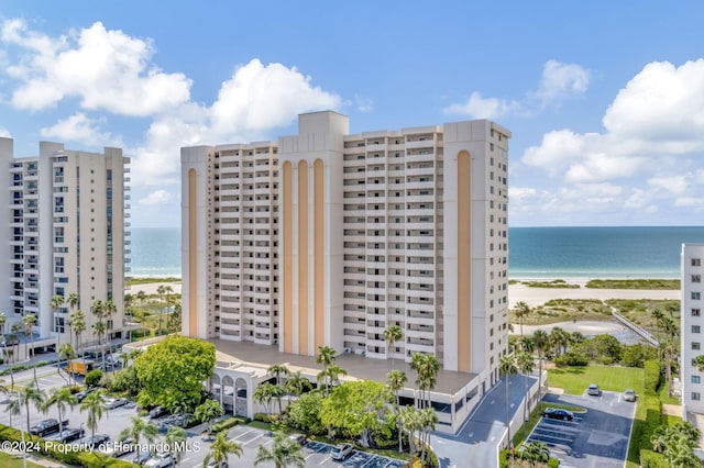 view of property featuring a water view and a view of the beach