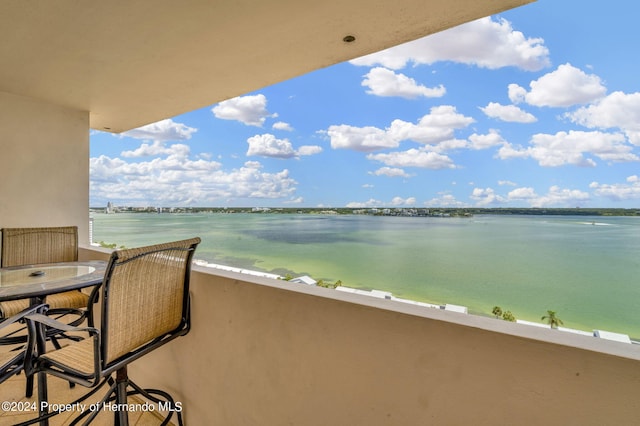 balcony featuring a water view