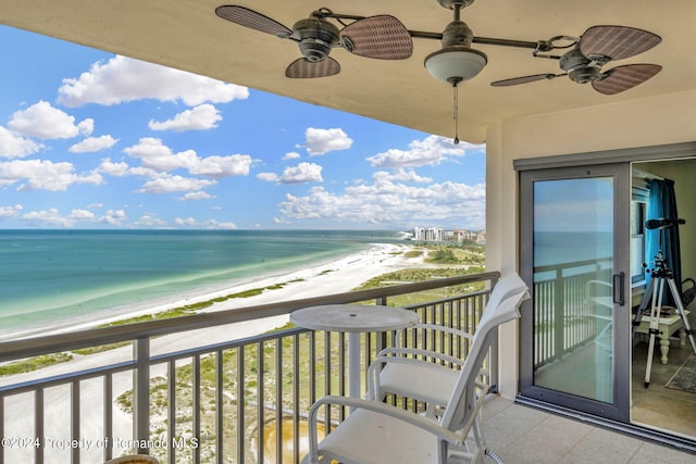 balcony with a view of the beach and a water view