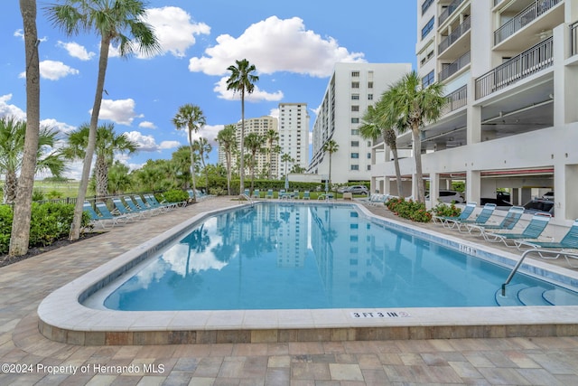 view of swimming pool with a patio area