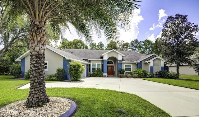 single story home with a front lawn