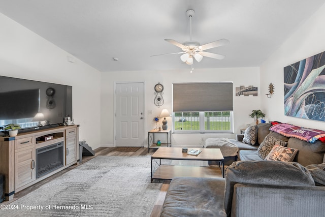 living room with light wood-type flooring and ceiling fan