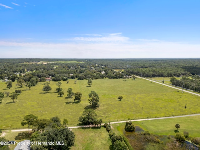 birds eye view of property featuring a rural view