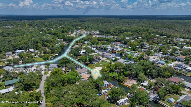 5369 Tuscawilla Dr, Weeki Wachee, FL 34607 - aerial view of property and surrounding area featuring a forest and nearby suburban area
