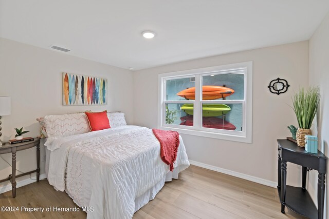 bedroom with light hardwood / wood-style floors