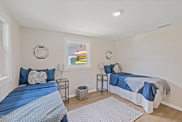 bedroom with light wood-type flooring