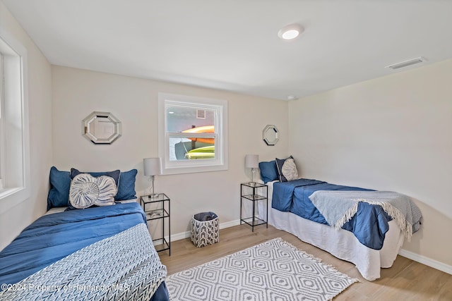 5369 Tuscawilla Dr, Weeki Wachee, FL 34607 - bedroom with wood finished floors and baseboards