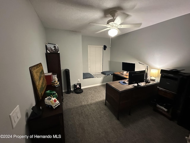 home office featuring carpet flooring, a textured ceiling, and ceiling fan