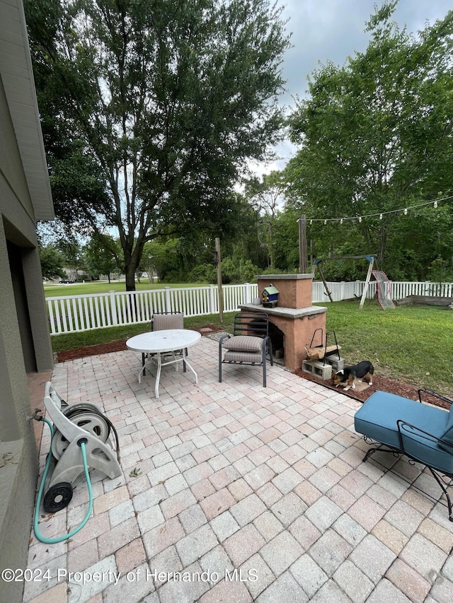 view of patio featuring a playground