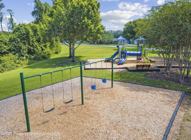 exterior space with a yard and a playground