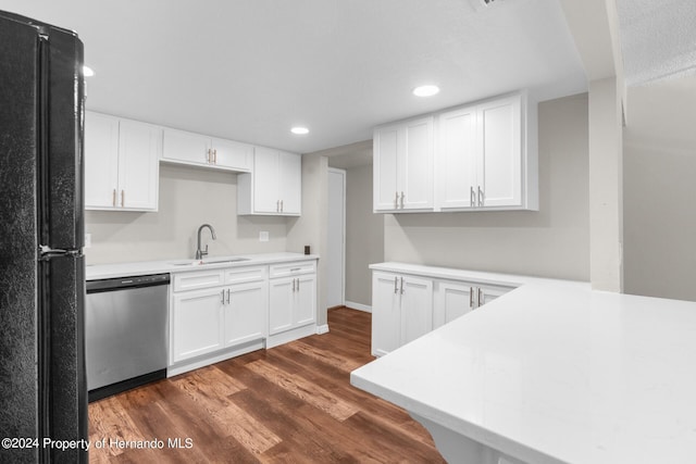 kitchen with white cabinetry, sink, black fridge, dark hardwood / wood-style floors, and dishwasher