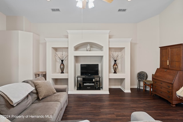 living room with built in features, ceiling fan, and dark hardwood / wood-style floors