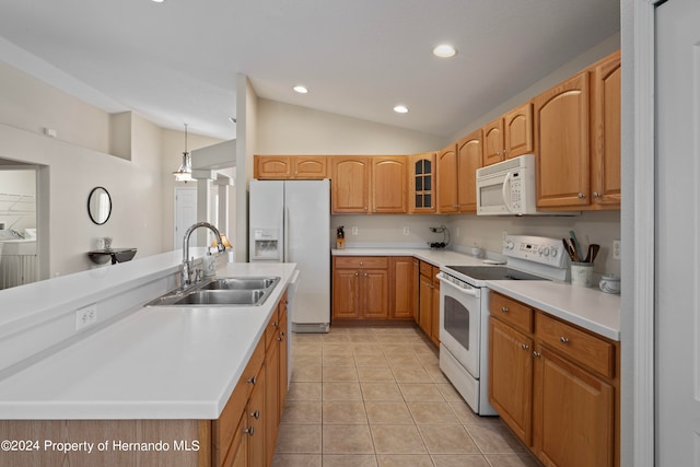 kitchen with vaulted ceiling, sink, light tile patterned floors, washer and clothes dryer, and white appliances