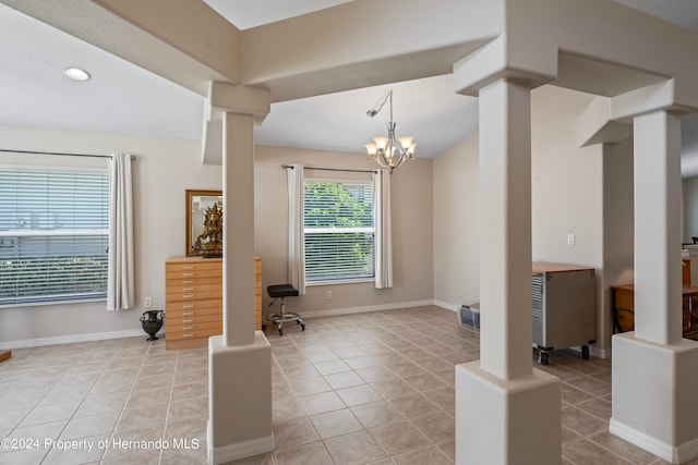 interior space featuring light tile patterned floors and an inviting chandelier