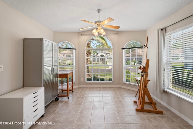 interior space featuring ceiling fan