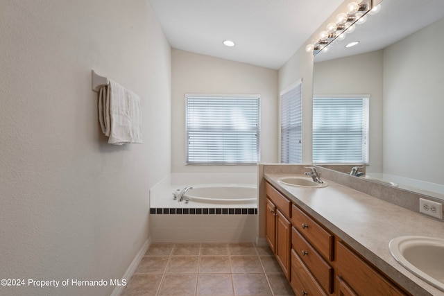 bathroom with vanity, tiled bath, tile patterned floors, and lofted ceiling