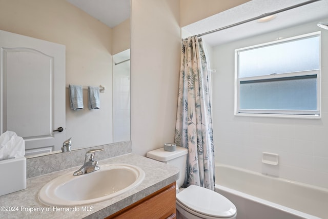 full bathroom with toilet, shower / bath combo, and vanity