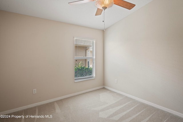 unfurnished room featuring ceiling fan and light carpet