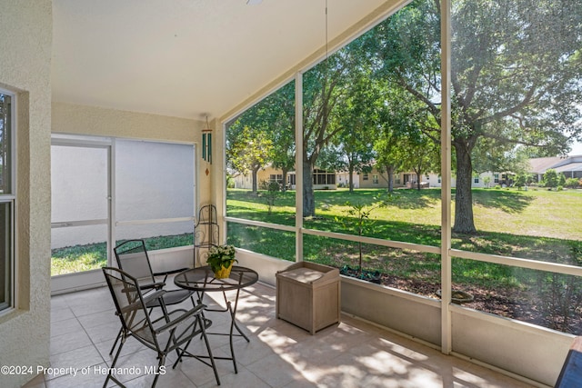 sunroom / solarium featuring a healthy amount of sunlight