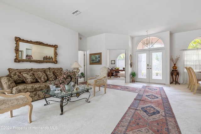 21312 Preservation Dr, Land O Lakes, FL 34638 - living area featuring visible vents, french doors, and carpet