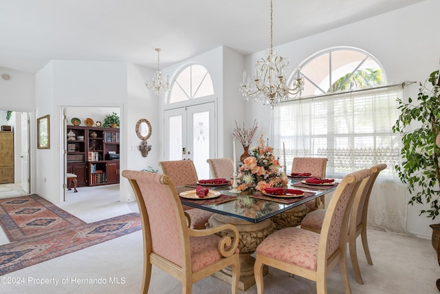 21312 Preservation Dr, Land O Lakes, FL 34638 - dining space featuring an inviting chandelier, plenty of natural light, and light colored carpet