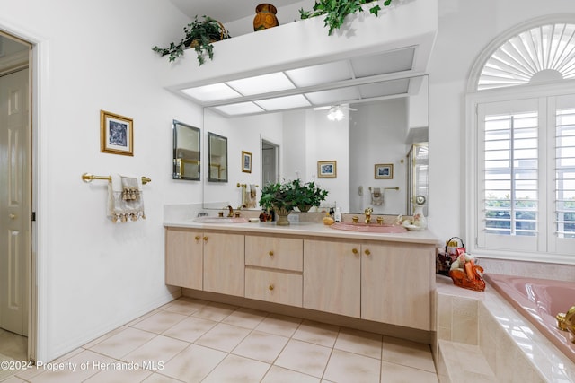21312 Preservation Dr, Land O Lakes, FL 34638 - bathroom featuring tile patterned floors, tiled bath, double vanity, and a sink