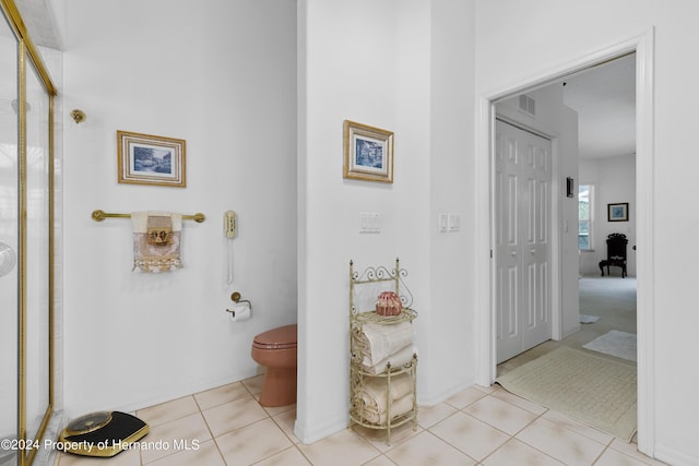 21312 Preservation Dr, Land O Lakes, FL 34638 - bathroom with tile patterned floors, visible vents, toilet, and an enclosed shower