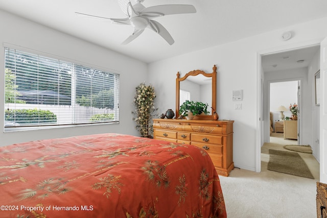 21312 Preservation Dr, Land O Lakes, FL 34638 - bedroom with baseboards, a ceiling fan, and light colored carpet