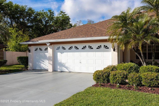 21312 Preservation Dr, Land O Lakes, FL 34638 - garage with concrete driveway