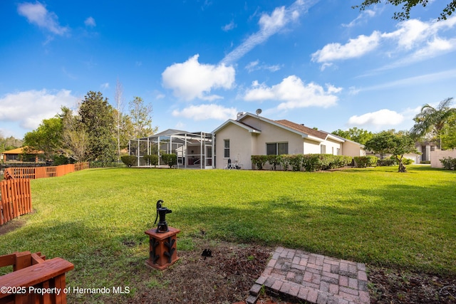 21312 Preservation Dr, Land O Lakes, FL 34638 - view of yard with glass enclosure and fence