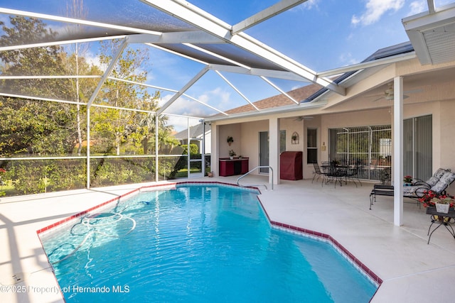 21312 Preservation Dr, Land O Lakes, FL 34638 - outdoor pool featuring ceiling fan, a lanai, and a patio