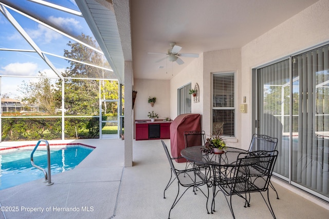 21312 Preservation Dr, Land O Lakes, FL 34638 - outdoor pool with ceiling fan, a lanai, and a patio area