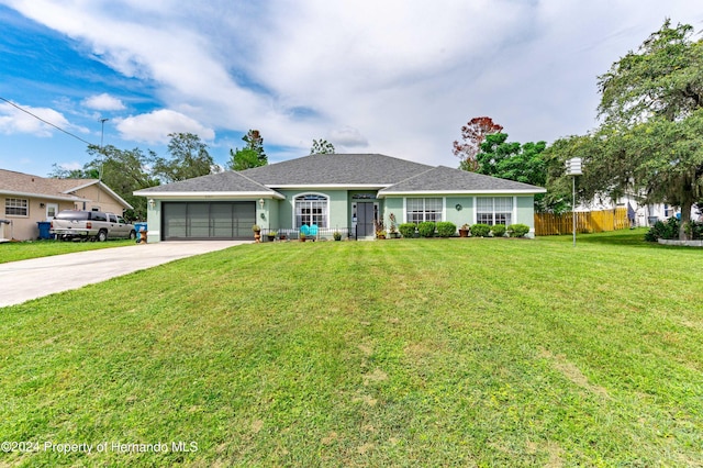 single story home with a front lawn and a garage