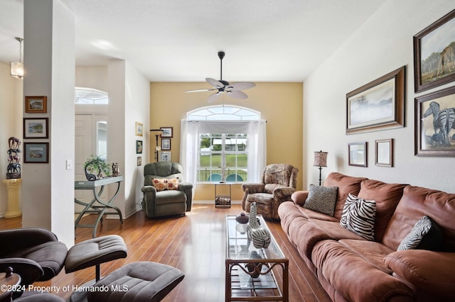 living room with light wood-type flooring and ceiling fan