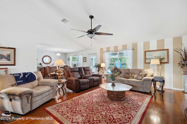 living room featuring dark hardwood / wood-style flooring and ceiling fan