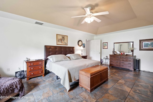 bedroom with ceiling fan and lofted ceiling