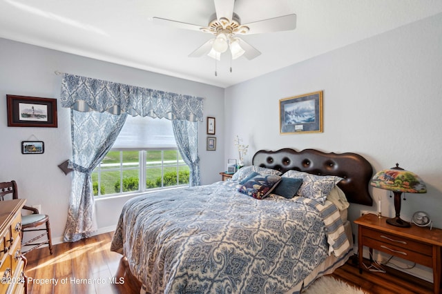 bedroom featuring ceiling fan and wood-type flooring