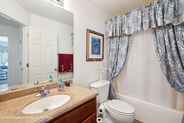 full bathroom with toilet, vanity, and shower / bath combination with curtain