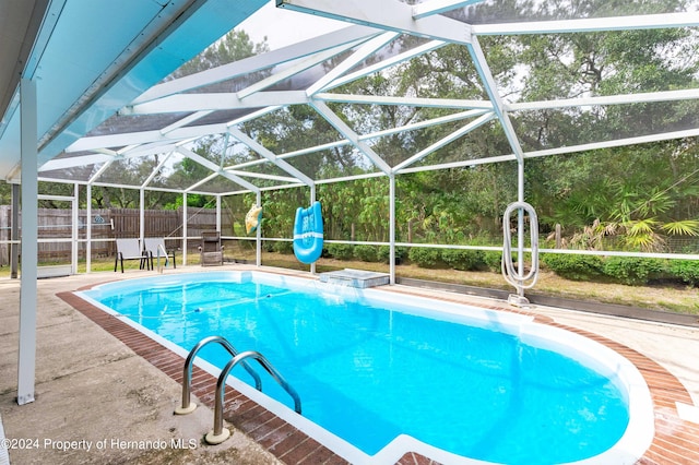 view of pool featuring a patio and a lanai