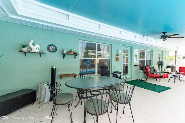 view of patio featuring ceiling fan