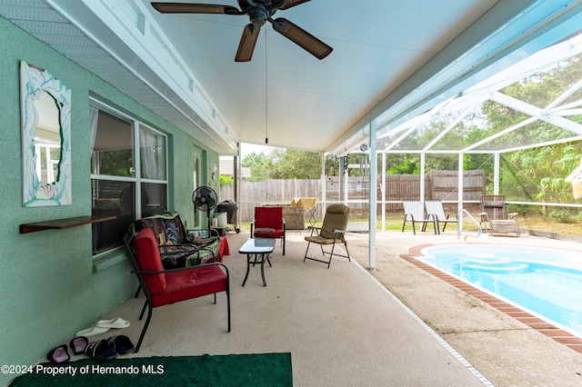 view of swimming pool with a lanai and a patio area