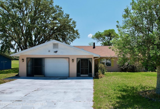 single story home with a garage and a front lawn