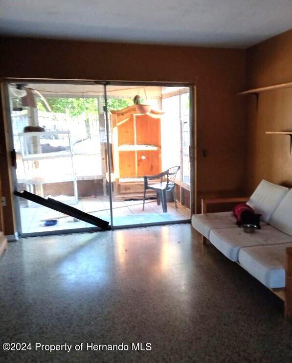 unfurnished living room featuring a wealth of natural light