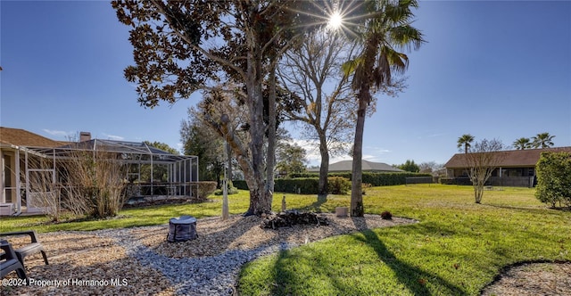 view of yard with a lanai