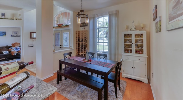 dining space with light hardwood / wood-style floors