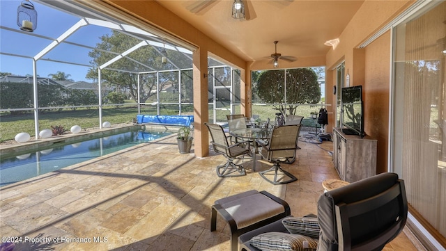 view of patio / terrace with glass enclosure and ceiling fan